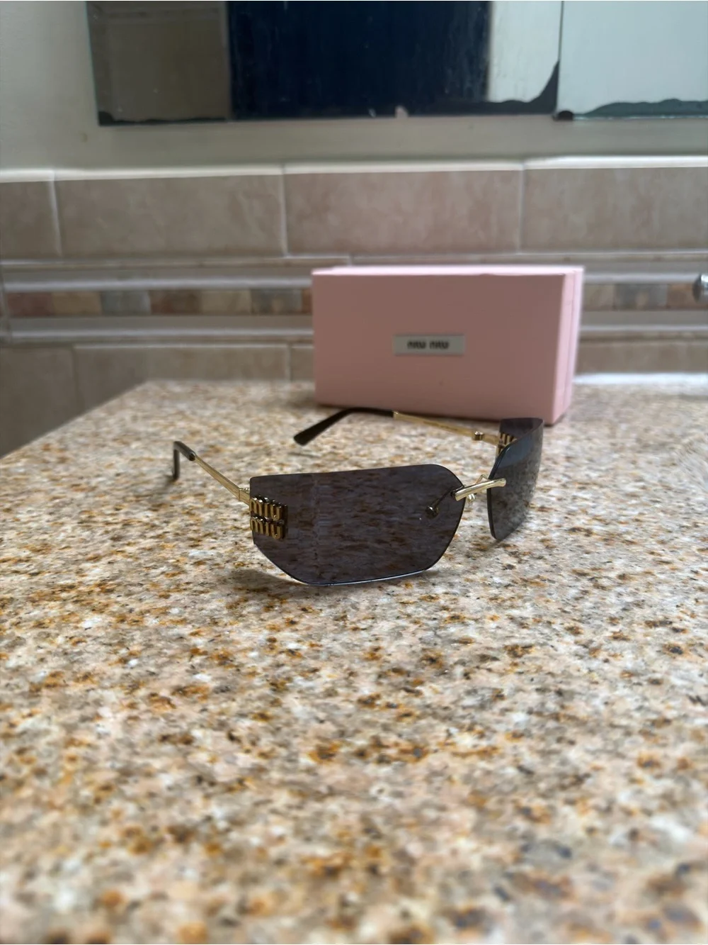 Miu Miu Rimless Sunglasses with Black Lenses and Gold Temples